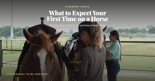 Two adult beginners standing with saddled horses at the fence line before a first riding lesson at Highbrow Ranch in Caldwell, Texas